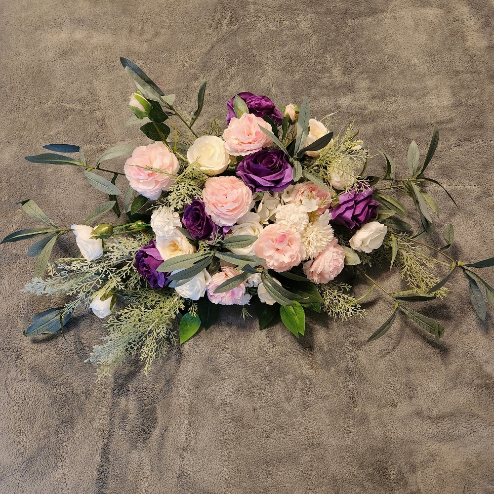 White, pink and purple artificial flower swag